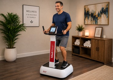 Client using the Whole Body Vibration platform at Natural Beauty Studio