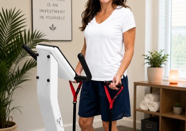 Client using the Whole Body Vibration platform at Natural Beauty Studio