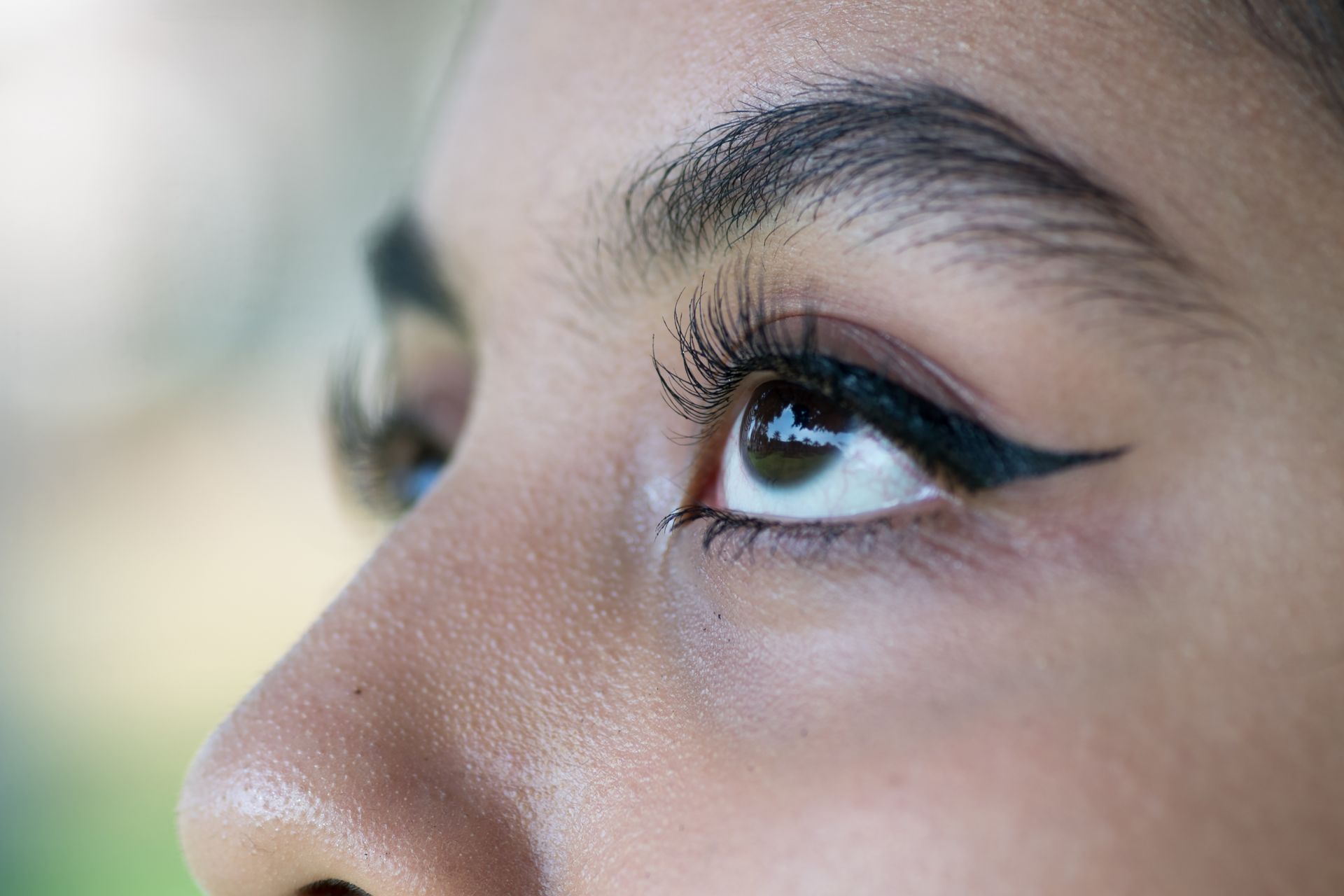 Beautiful Asian eyes sporting luscious brows.